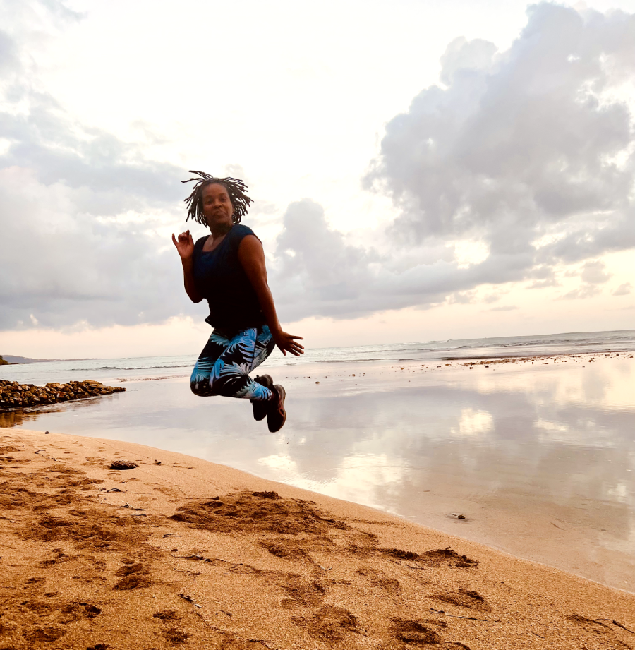 Woman Jumping in the Air on the Beach